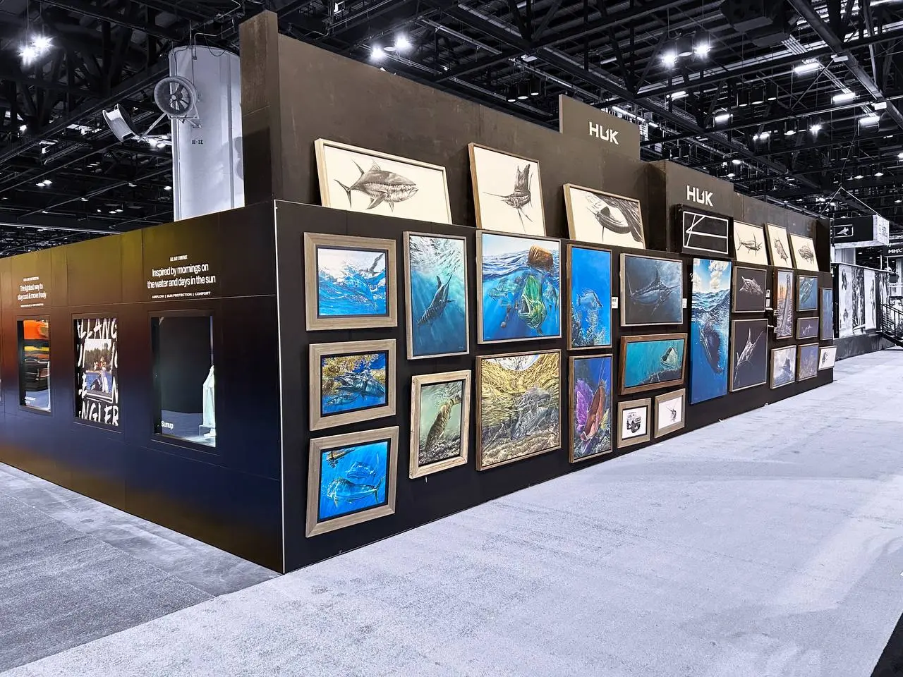 Huk gallery-style art wall with marine paintings