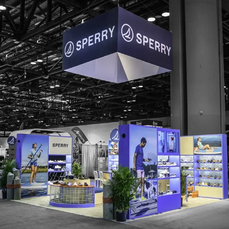 Sperry booth with hanging cube sign and shoe displays