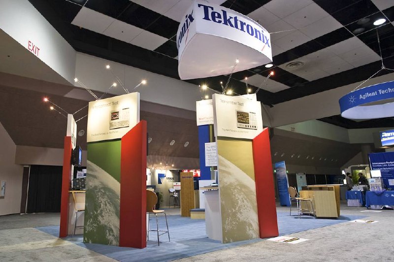 Tektronix booth on the show floor with a wide view of neighboring exhibits